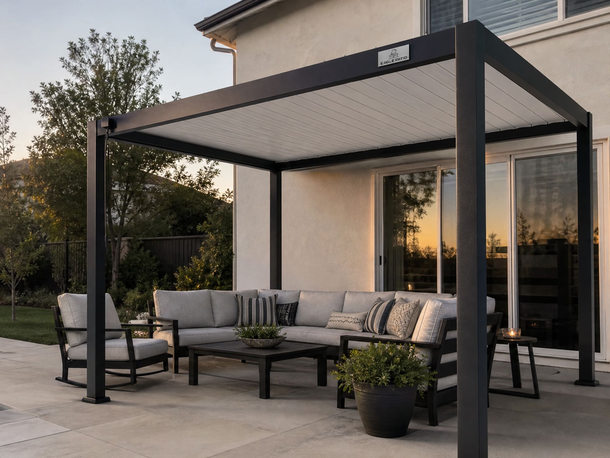 Aluminum louvered pergola creating a shaded outdoor area in a sunny backyard