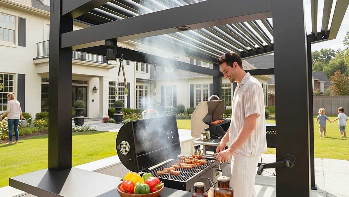 A man smiles while grilling sausages and skewers under a black LUXPATIO pergola in his backyard. In the background, a woman and a child are seen playing on the grass.