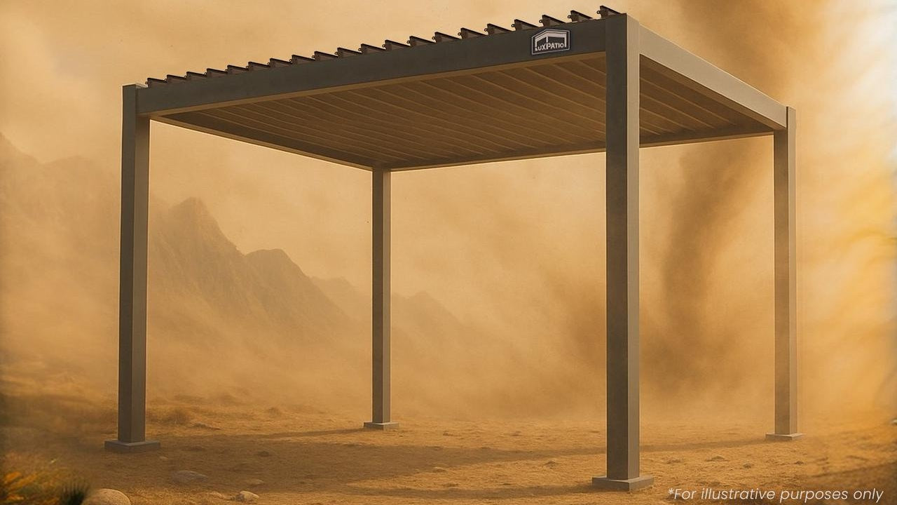 ​​LuxPavilion metal structure in desert sandstorm with mountain backdrop​​