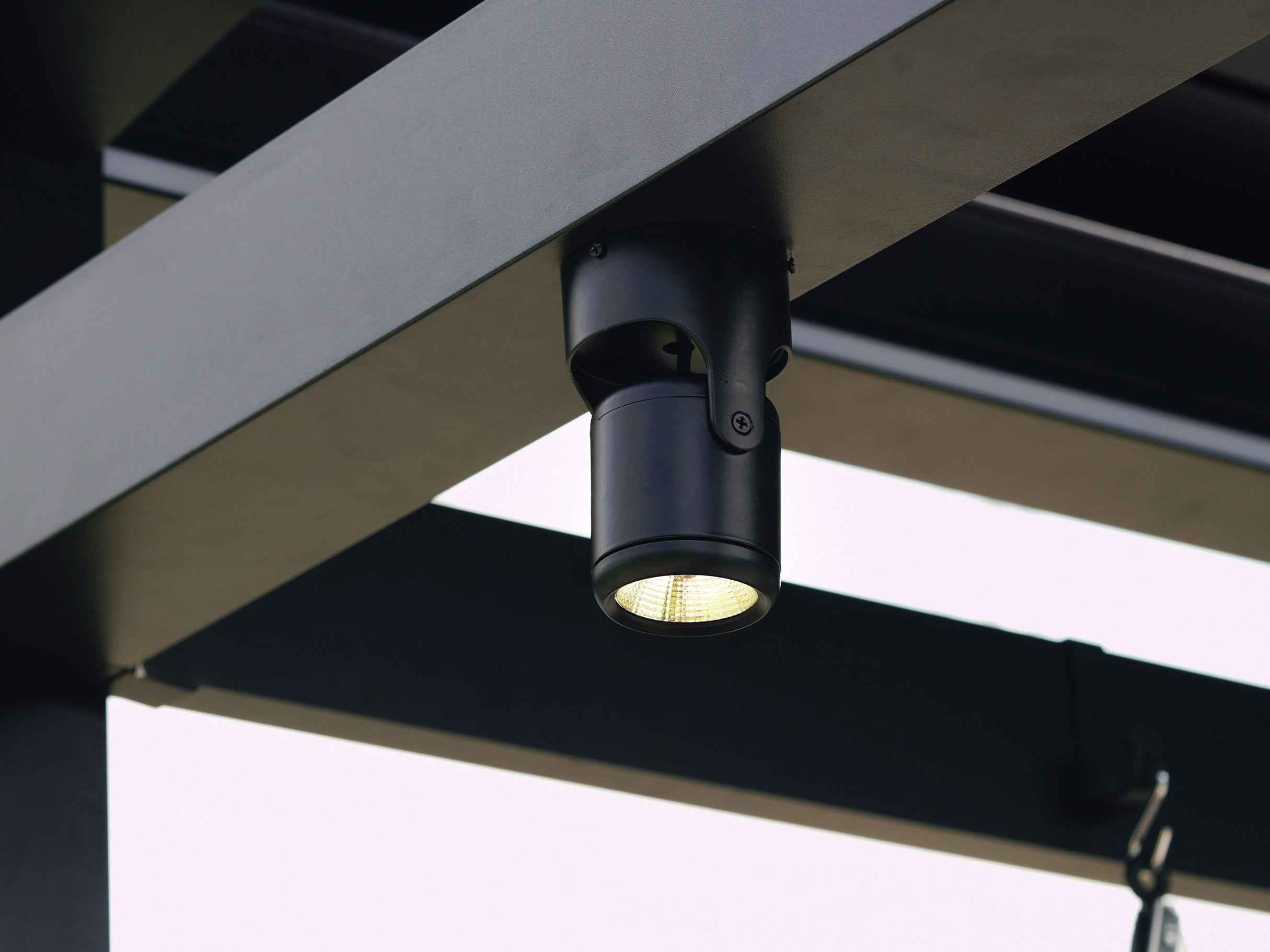 LuxPatio Grill Louvered Pergola Pro: Black LED spotlight on aluminum pergola for outdoor cooking.