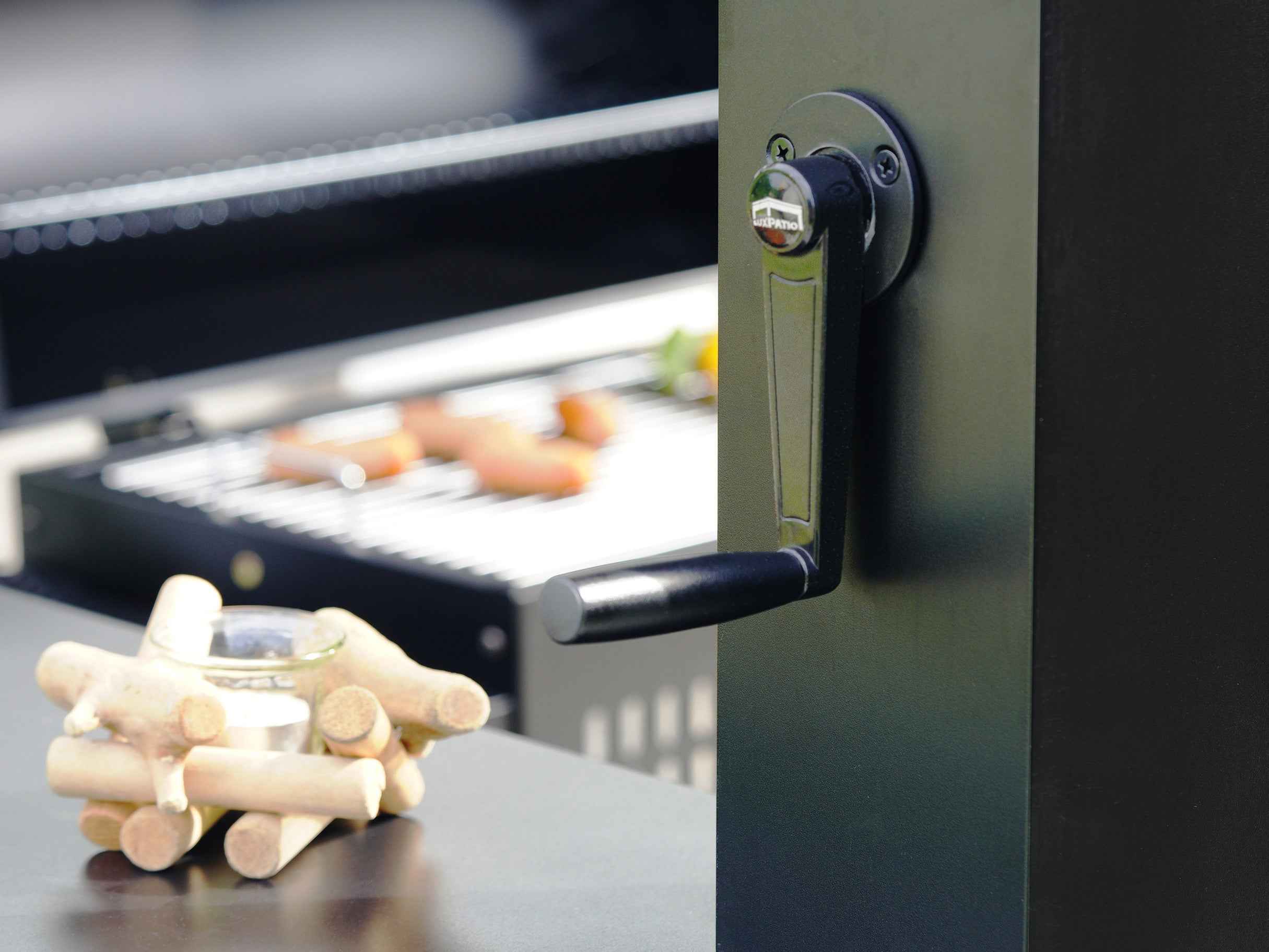 Grill Louvered Pergola Pro adjustment handle with LuxPatio logo, black aluminum, outdoor grilling setup